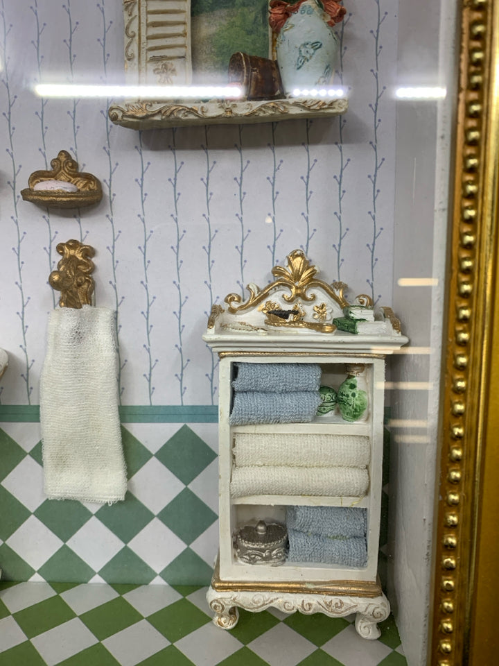 MINIATURE BATHROOM SCENE IN SHADOW BOX W/GOLD FRAME.