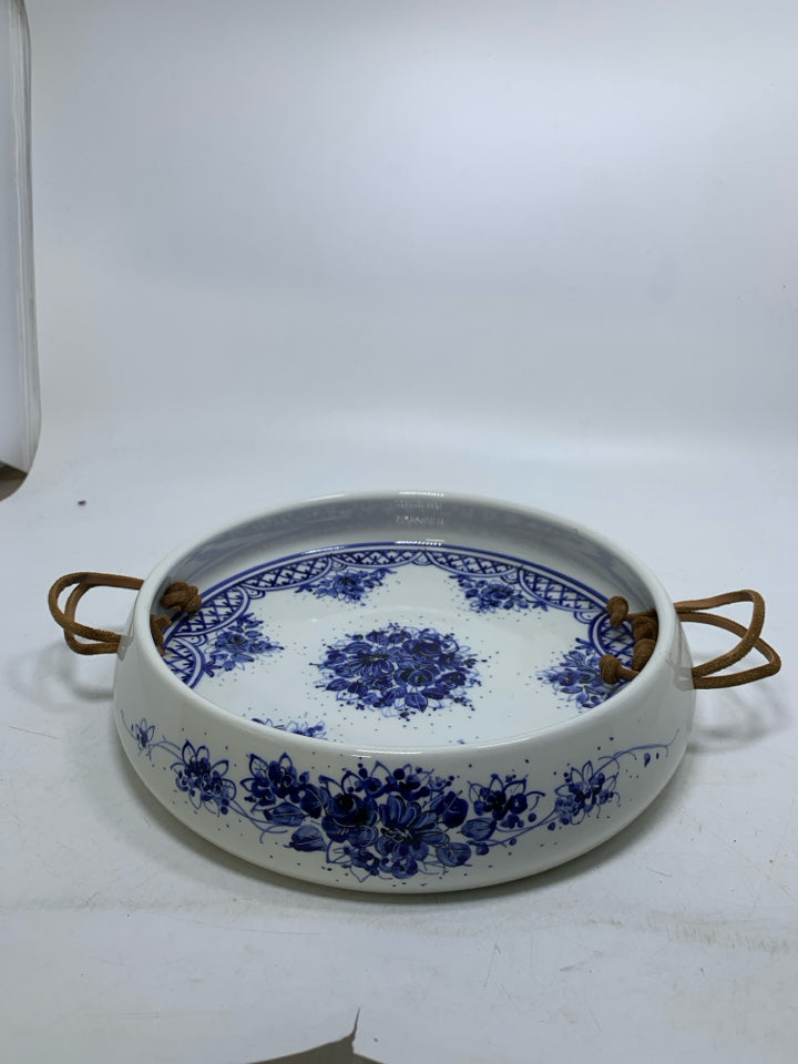 WHITE DEEP CERAMIC TRAY W/ BLUE FLORAL DESIGN LEATHER HANDLES.