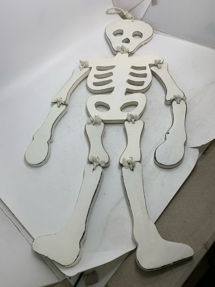 WHITE WOOD MOVEABLE SKELTON WALL HANGING.