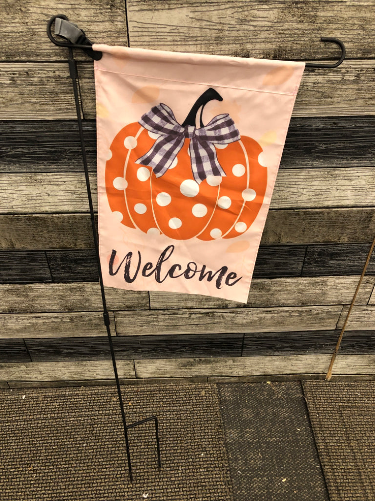 "WELCOME" PUMPKIN FLAG ON POLE.