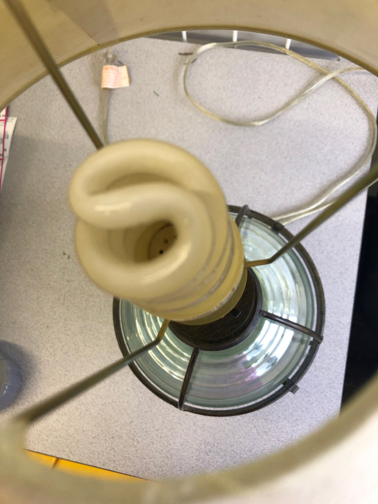 GREEN GLASS AND METAL BASE LAMP W/CREAM SHADE.