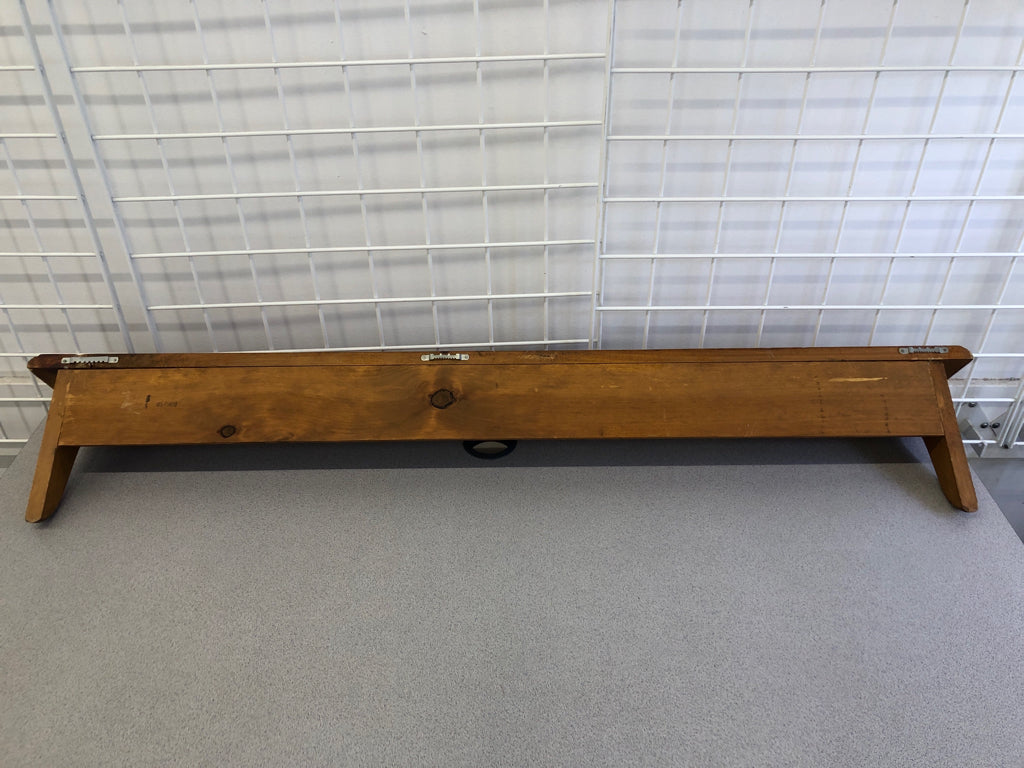 LIGHT BROWN WALL SHELF W/ COAT HOOKS.