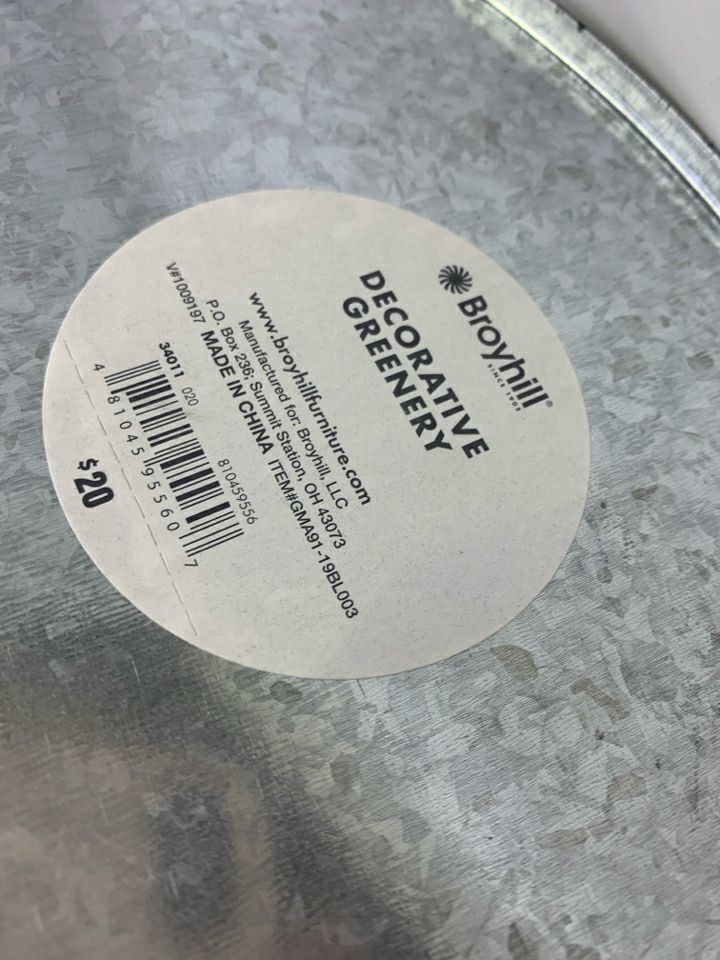 FAUX LEAVES & CREAM FLOWERS IN GALVANIZED TIN.