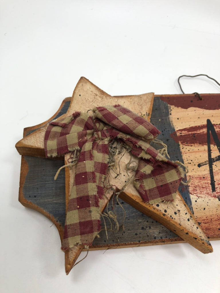 PRIMITIVE AMERICA SIGN W/WOOD STAR AND PLAID BOW.