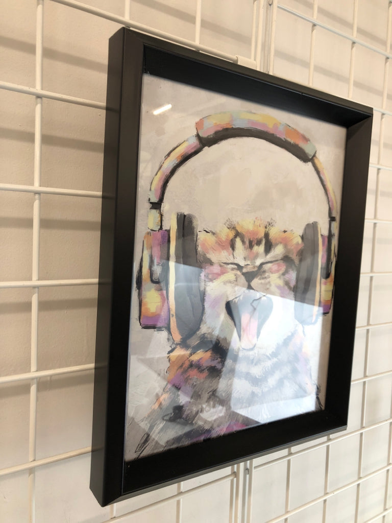 COLORFUL CAT WEARING HEADPHONES IN BLACK FRAME.