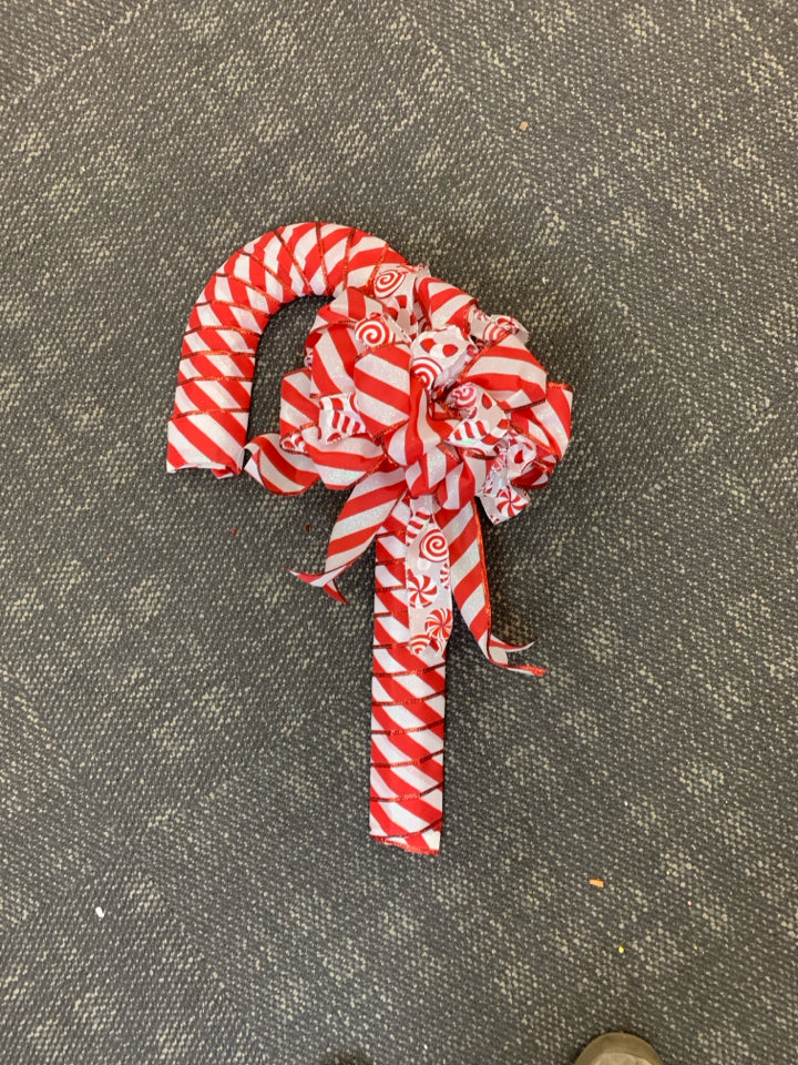 RED RIBBON CANDY CANE WALL HANGING.