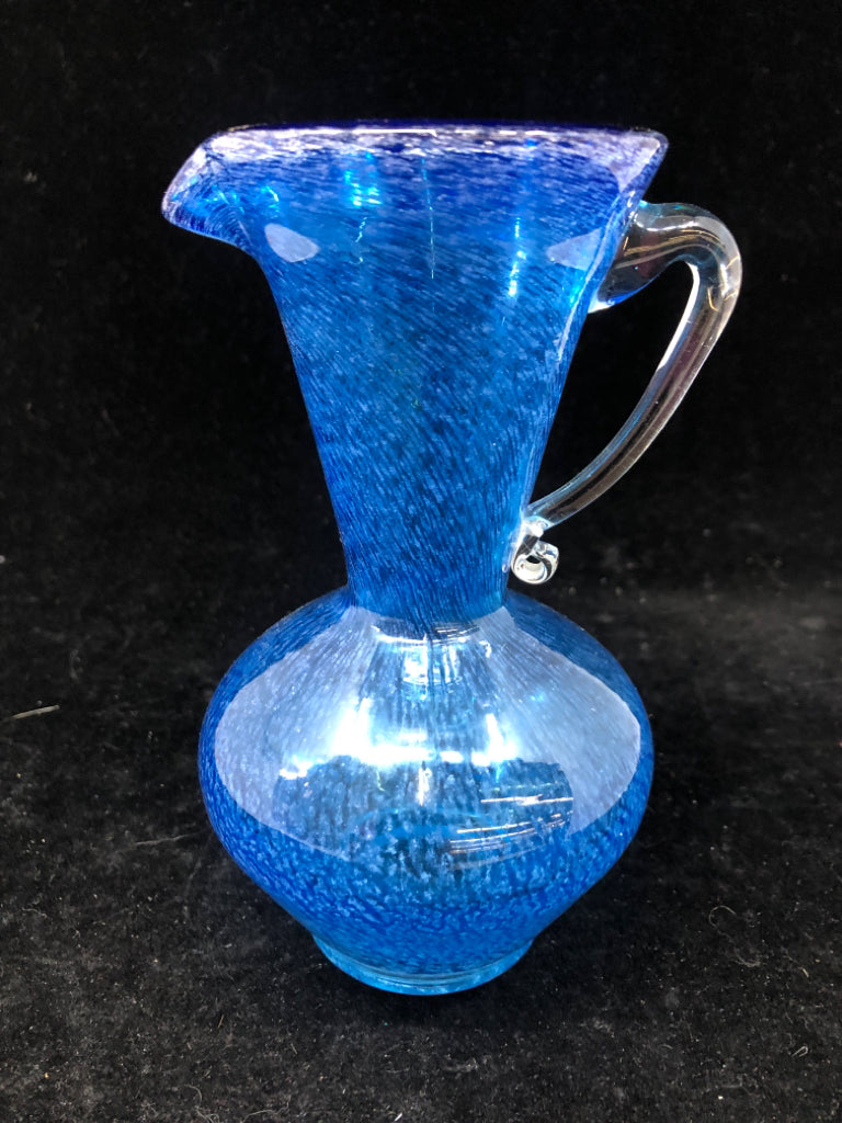 BLUE BLOWN GLASS PITCHER W/ CLEAR GLASS HANDLE.