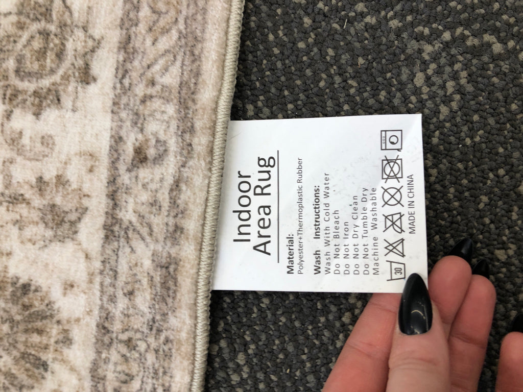 LIGHT GRAY RUG.