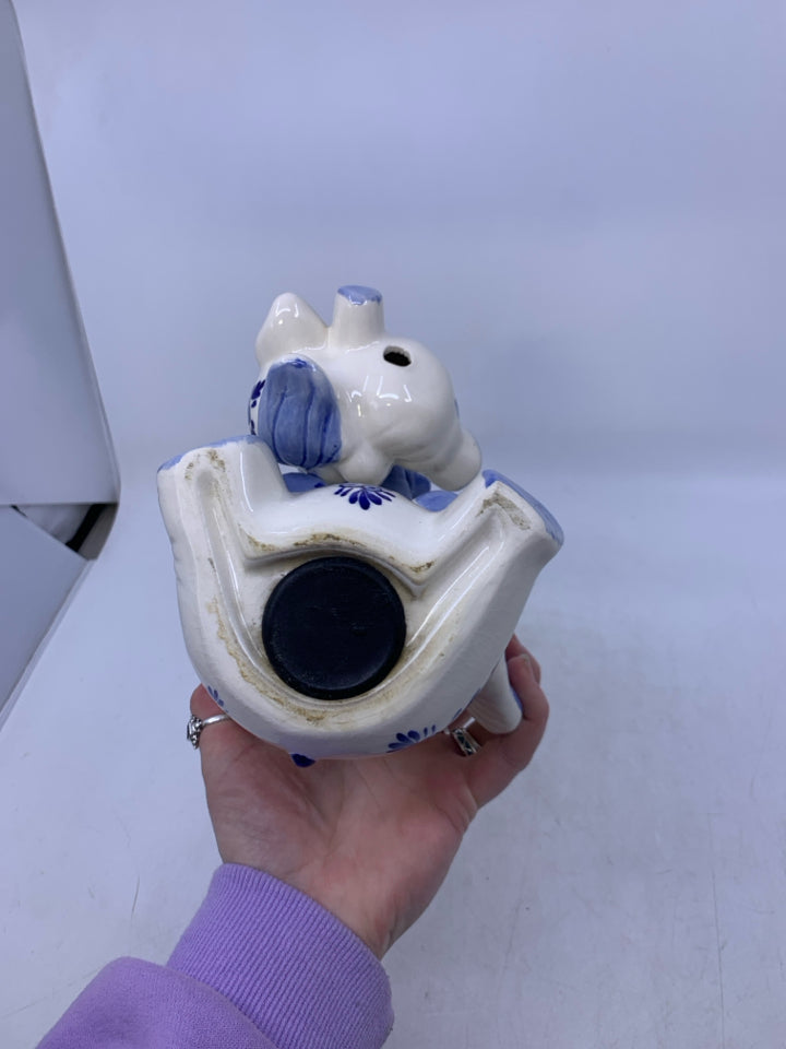 BLUE/WHITE SITTING ELEPHANT W/ BABY HANGING FROM TRUNK COIN BANK.