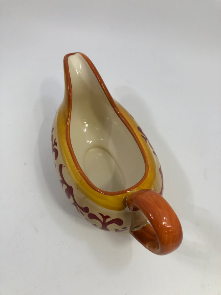 ORANGE SCROLL DESIGN GRAVY BOAT STONEWARE.