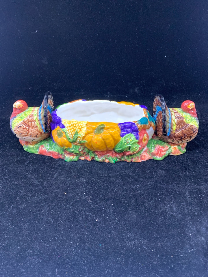 COLORFUL THANKSGIVING DISH W TURKEYS ON END.