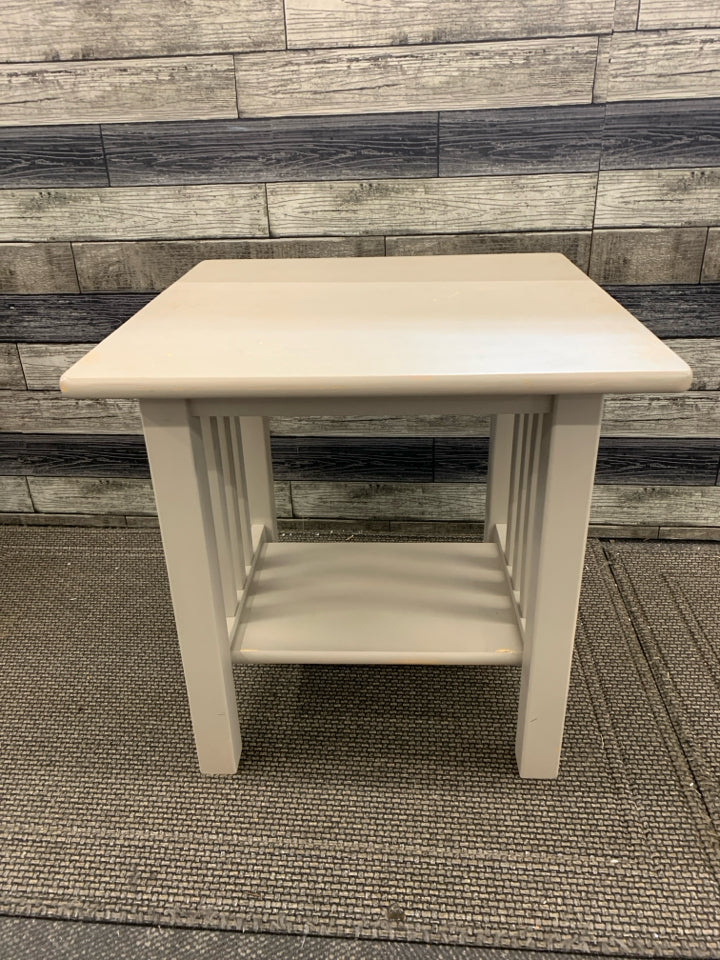 TAN BOTTOM SHELF END TABLE.