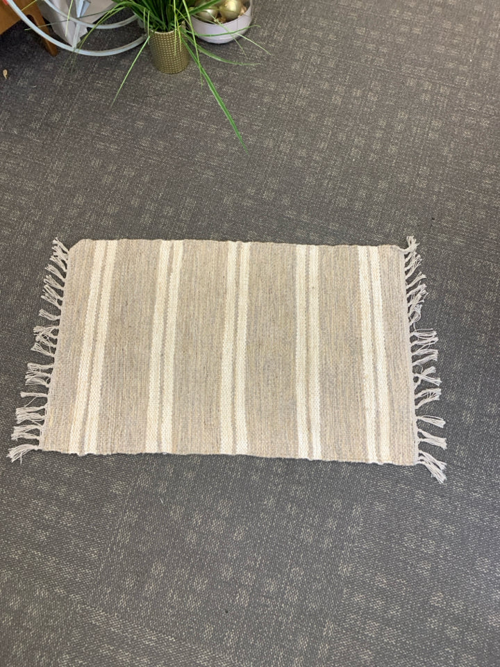 CREAM STRIPE AREA RUG W FRINGE.