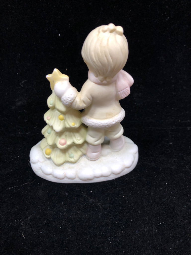 CHILD DECORATING TREE FIGURINE.