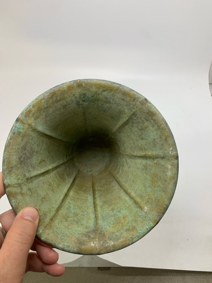 DISTRESSED FOOTED GREEN METAL VASE.