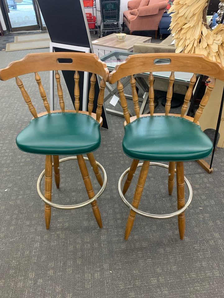 2 WOOD BAR STOOL W/GREEN UPHOLSTERED CUSHION & METAL FOOT REST.