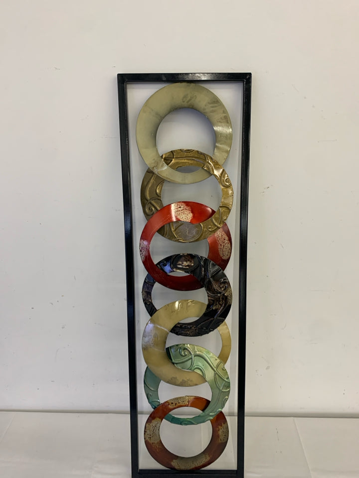 ABSTRACT CIRCLES METAL WALL HANGING.