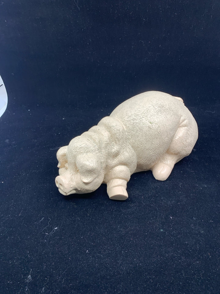 RESIN LAYING PIG.