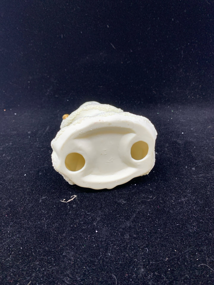 GOLD AND CREAM SANTA FIGURE.