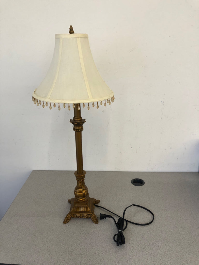 GOLD SKINNY BASE LAMP W WHITE SHADE AND JEWELS.