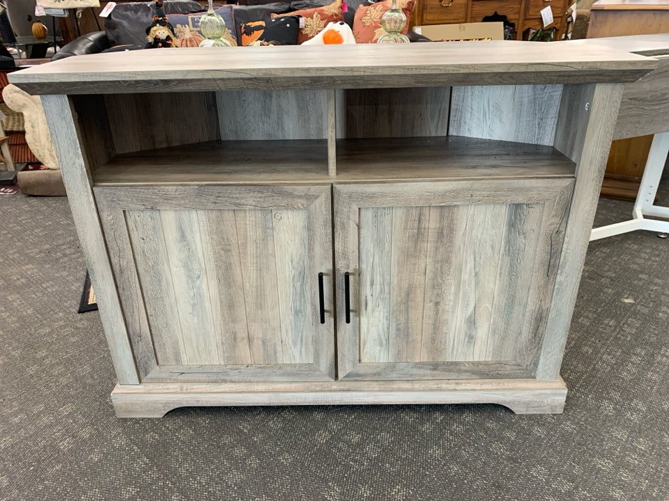 GREY CORNER TV STAND W CABINET ABD CUBBIE SHELF.