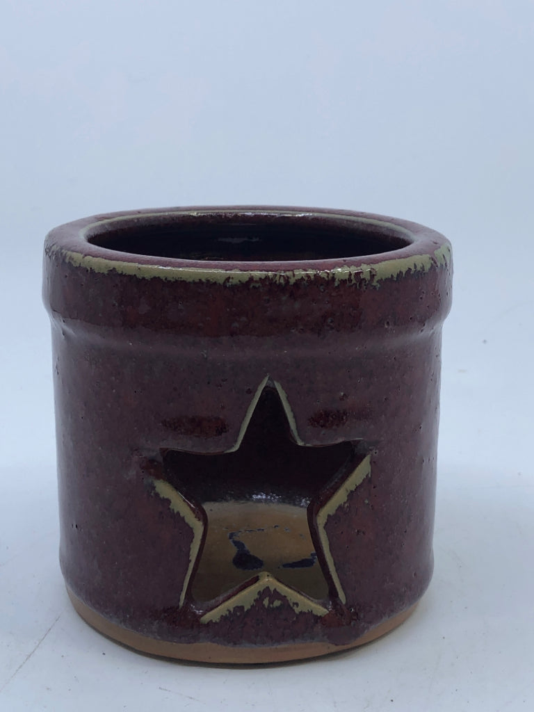 RED STAR CUT OUT TEA LIGHT HOLDER.