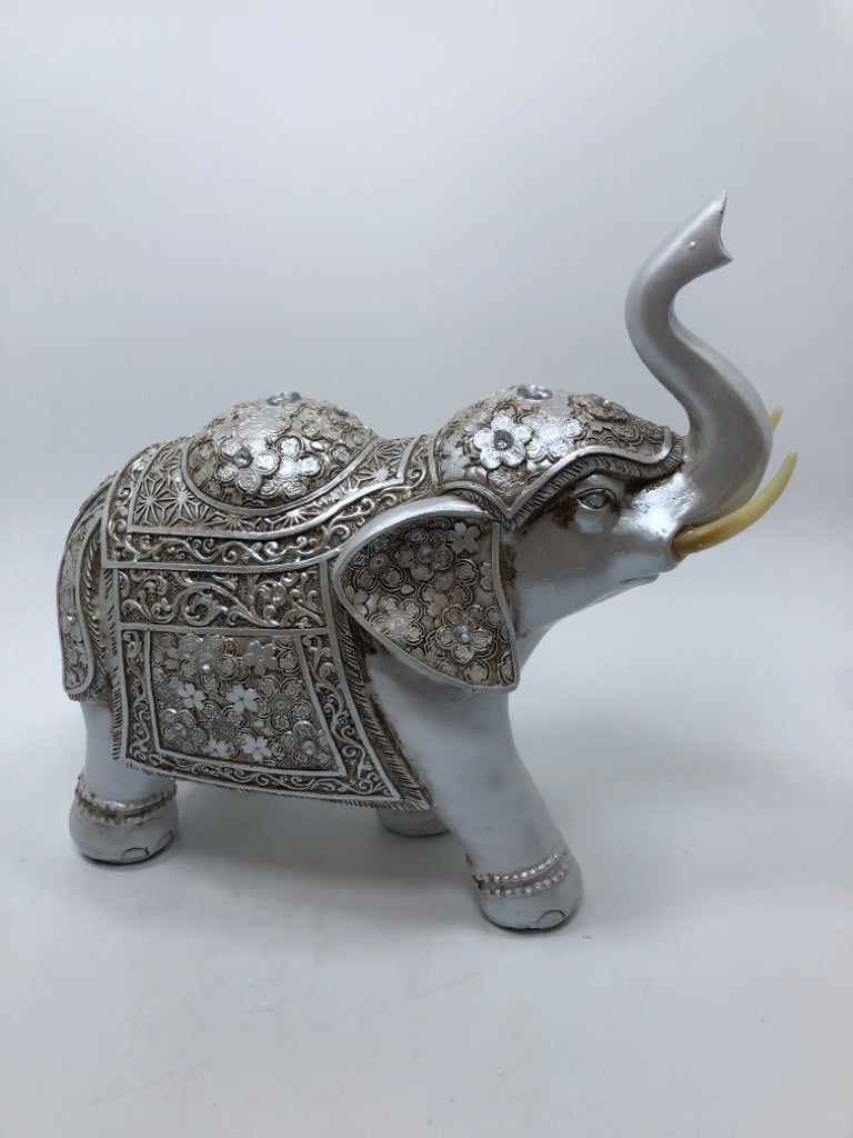 SILVER PAINTED RESIN ELEPHANT.