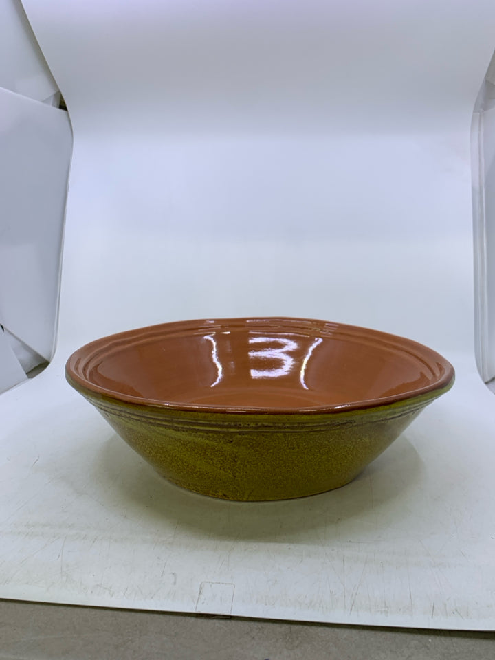 HEAVY TERRA COTTA SERVING BOWL W/ YELLOW OUTSIDE.