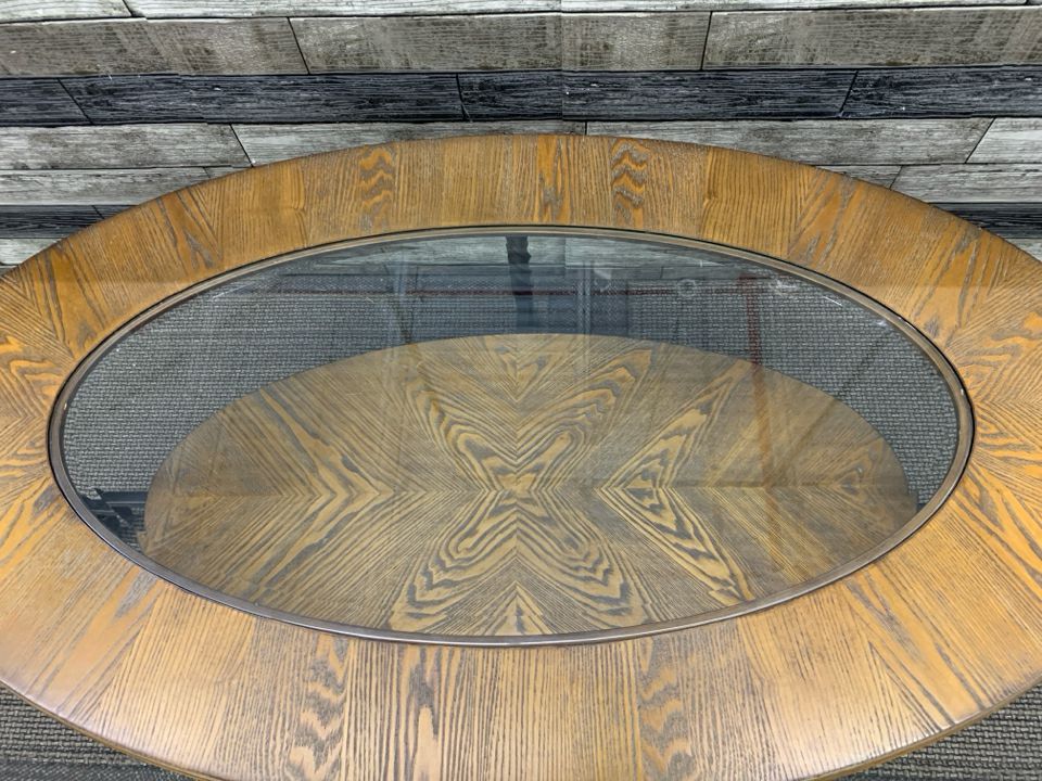 OVAL WOOD W GLASS TOP AND BOTTOM STORAGE COFFEE TABLE.