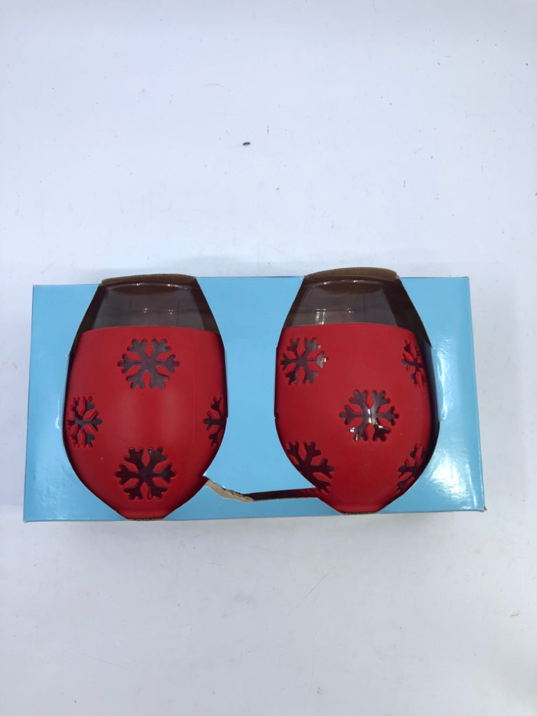 NIP 2 GLASS STEMLESS W/ RED SNOWFLAKE SILICONE SLEEVE.