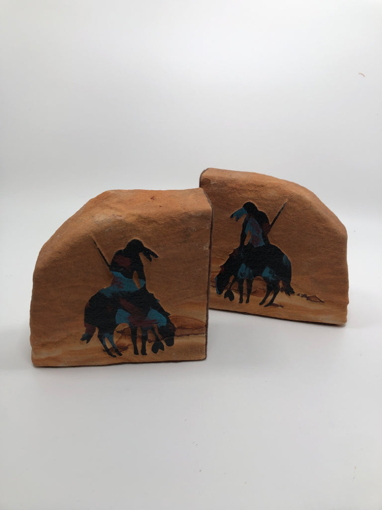 2 METAL HORSE RIDER ON SANDSTONE BOOKENDS.