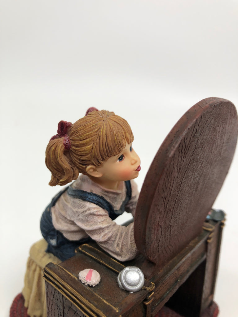 RESIN GIRL FIGURINE APPLYING MAKEUP.