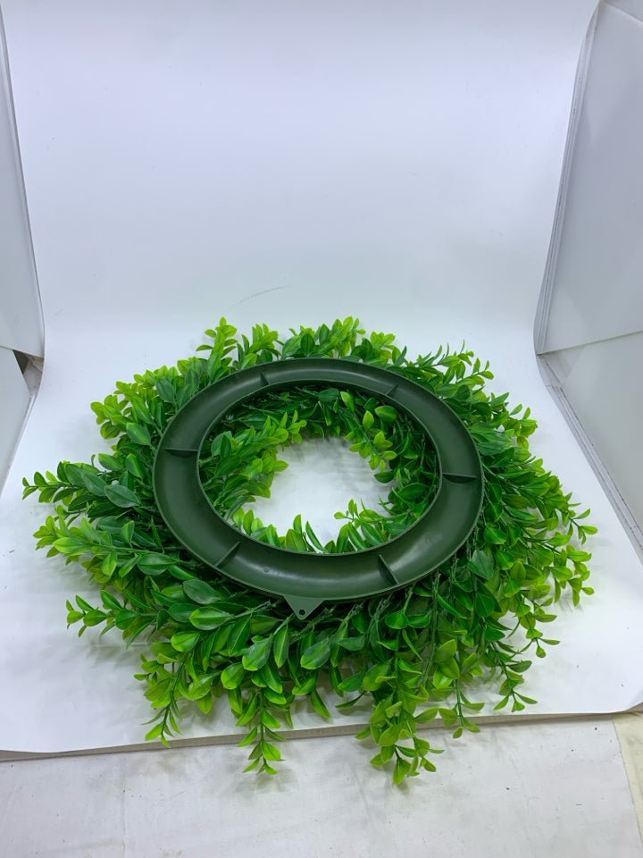 PLASTIC GREENS WREATH.