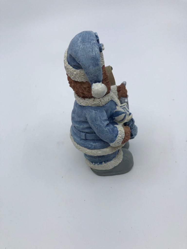 RESIN TEDDY BEAR IN BLUE COAT HOLDING SILVER BELL.