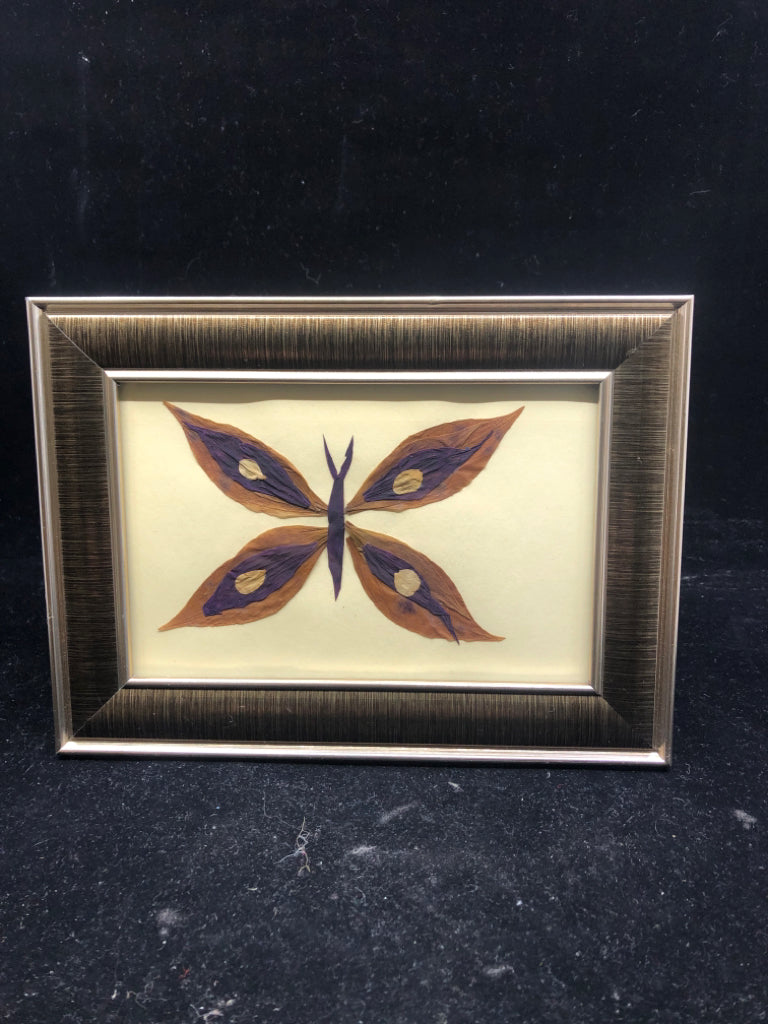 PURPLE FLORAL IN BROWN SLIVER FRAME.