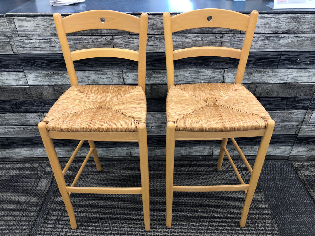 2 BLONDE BAR STOOLS W/ WICKER SEATS.