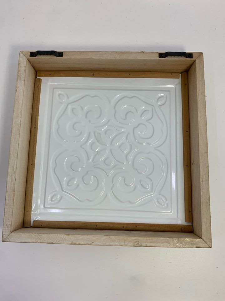 WHITE/PEACH DESIGN METAL TILE IN BLONDE WOOD FRAME.