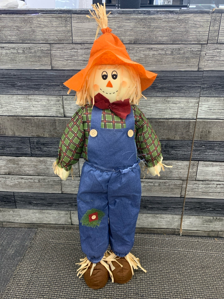 SCARECROW IN BLUE OVERALLS STANDING DECOR.