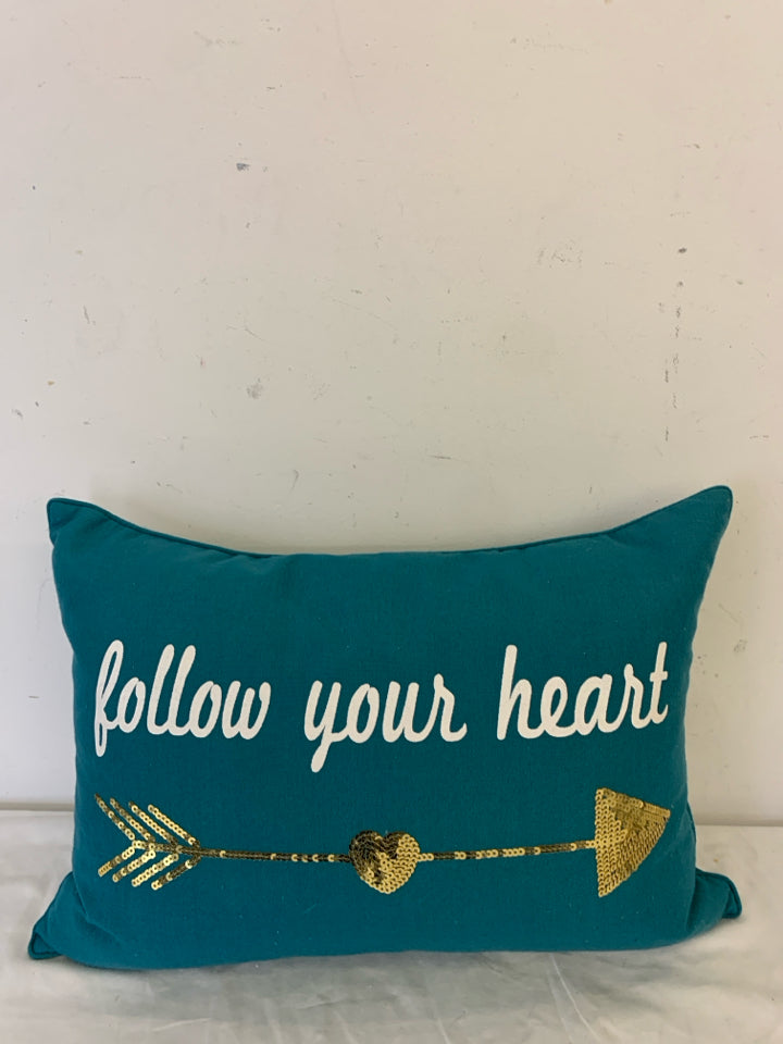 FOLLOW YOUR HEART TEAL PILLOW W/GOLD ARROW.