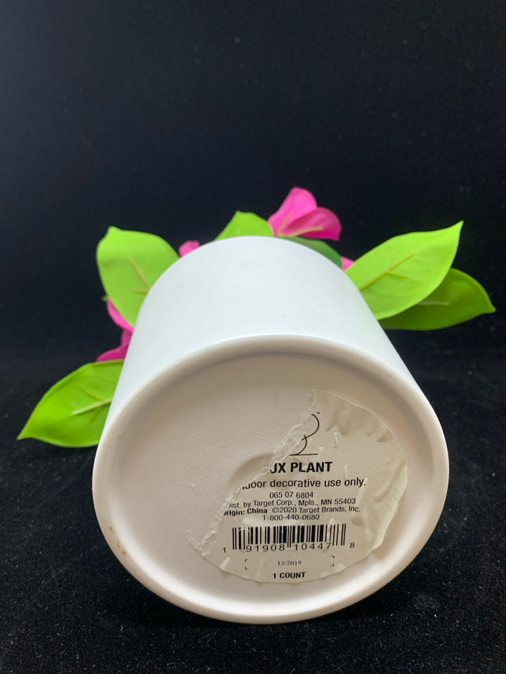 FAUX PINK FLORAL IN WHITE POT.