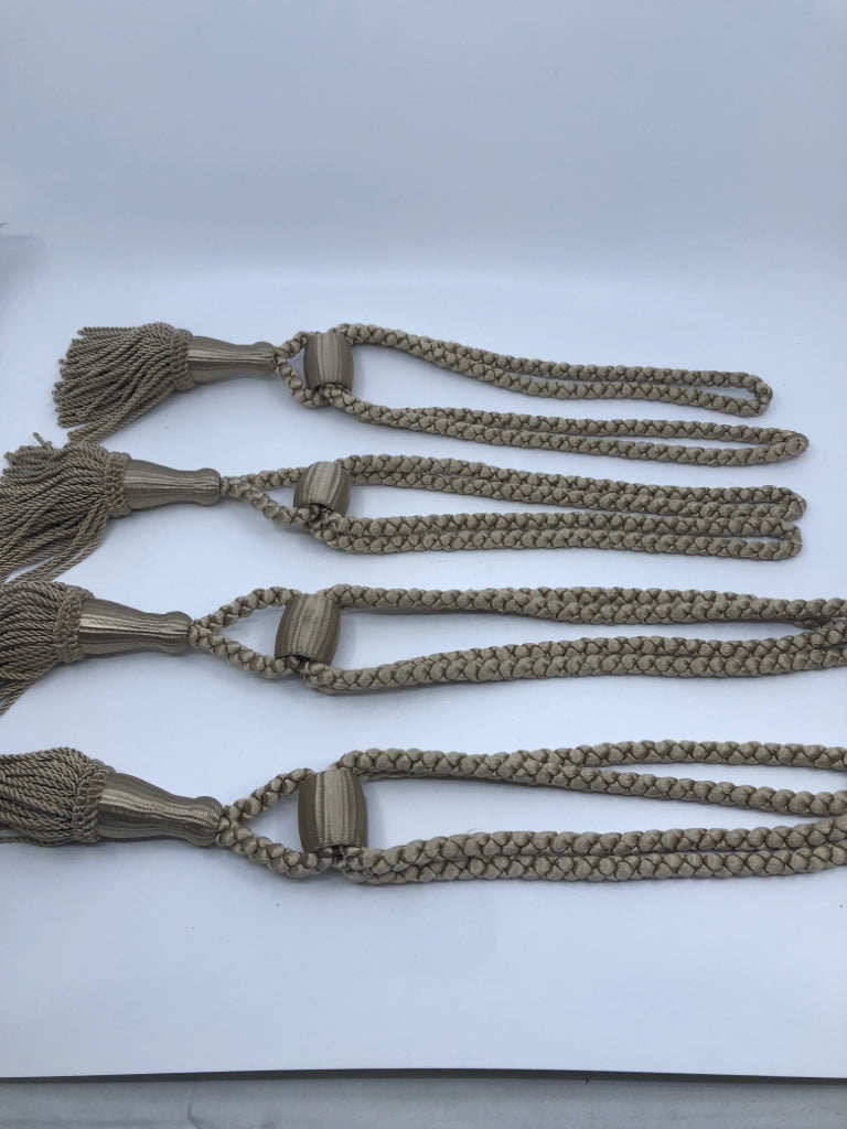 4 CREAM CURTIAN TIE BACKS.