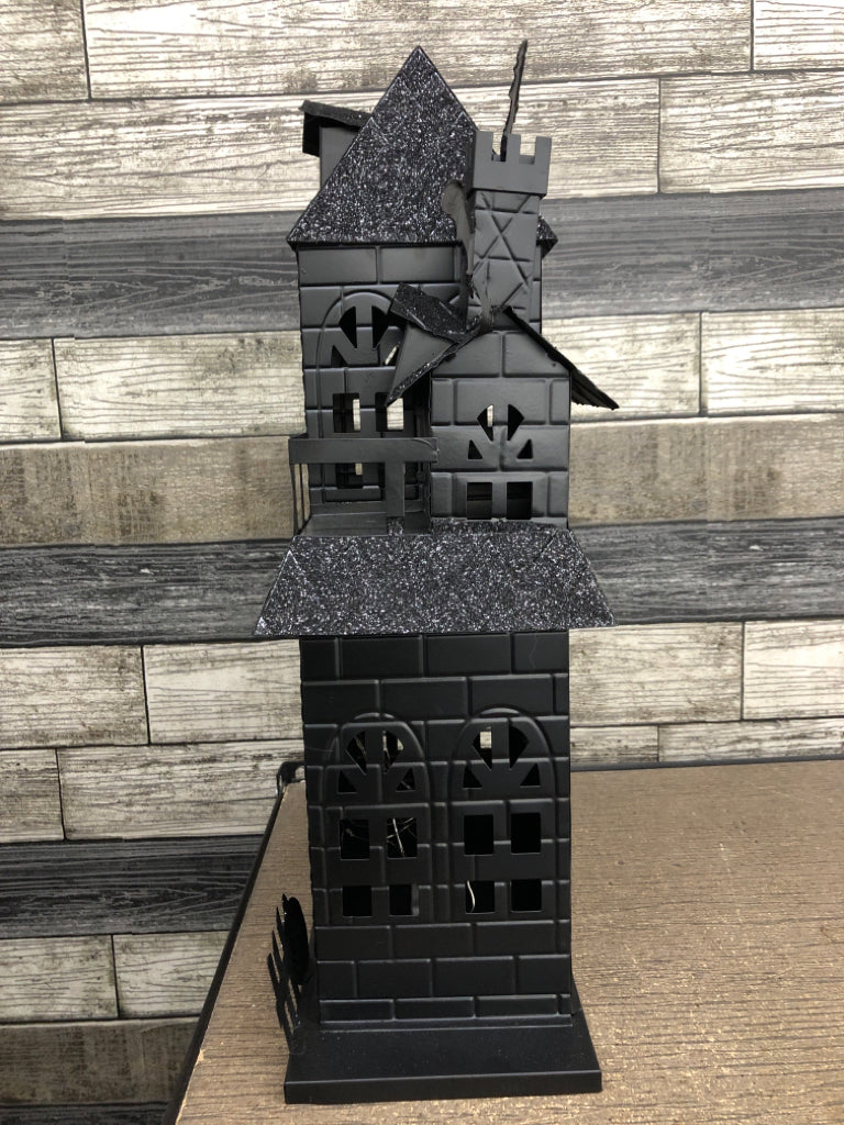BLACK METAL AND GLITTER LED HAUNTED HOUSE.