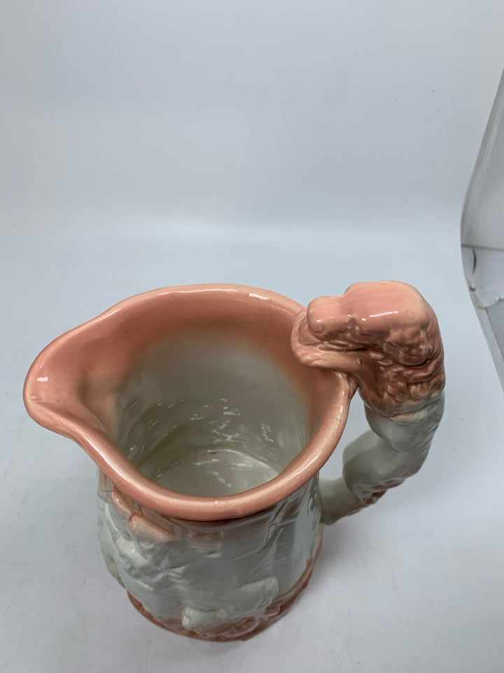 VTG MAIDEN READING W/ DOGS OMBRE PEACH COLOR DOG SHAPED HANDLE.