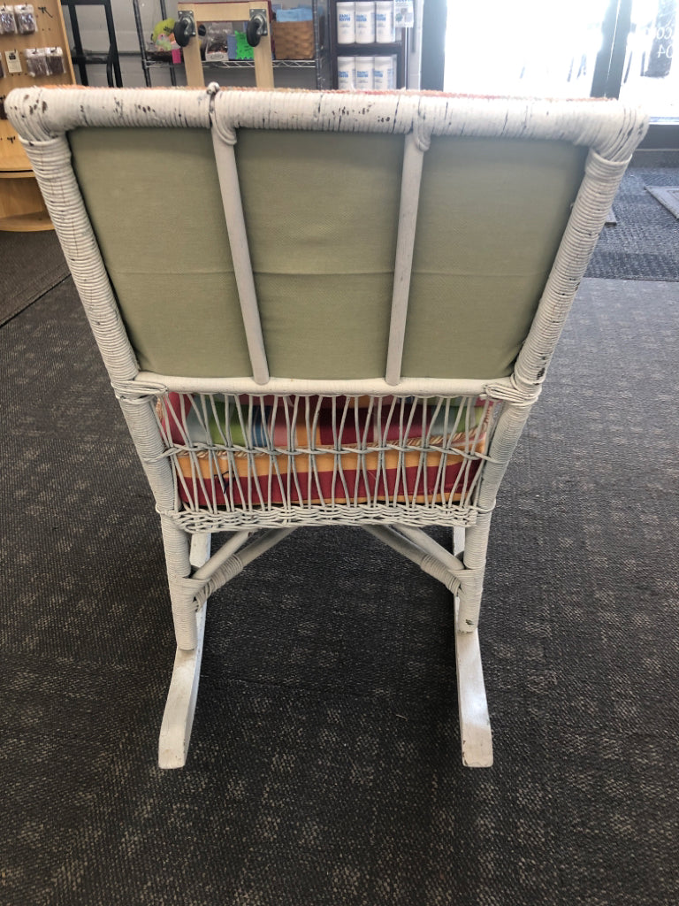 VTG WHITE WICKER ROCKING CHAIR W/ COLORFUL UPHOLSTERED BACK/CUSHION.
