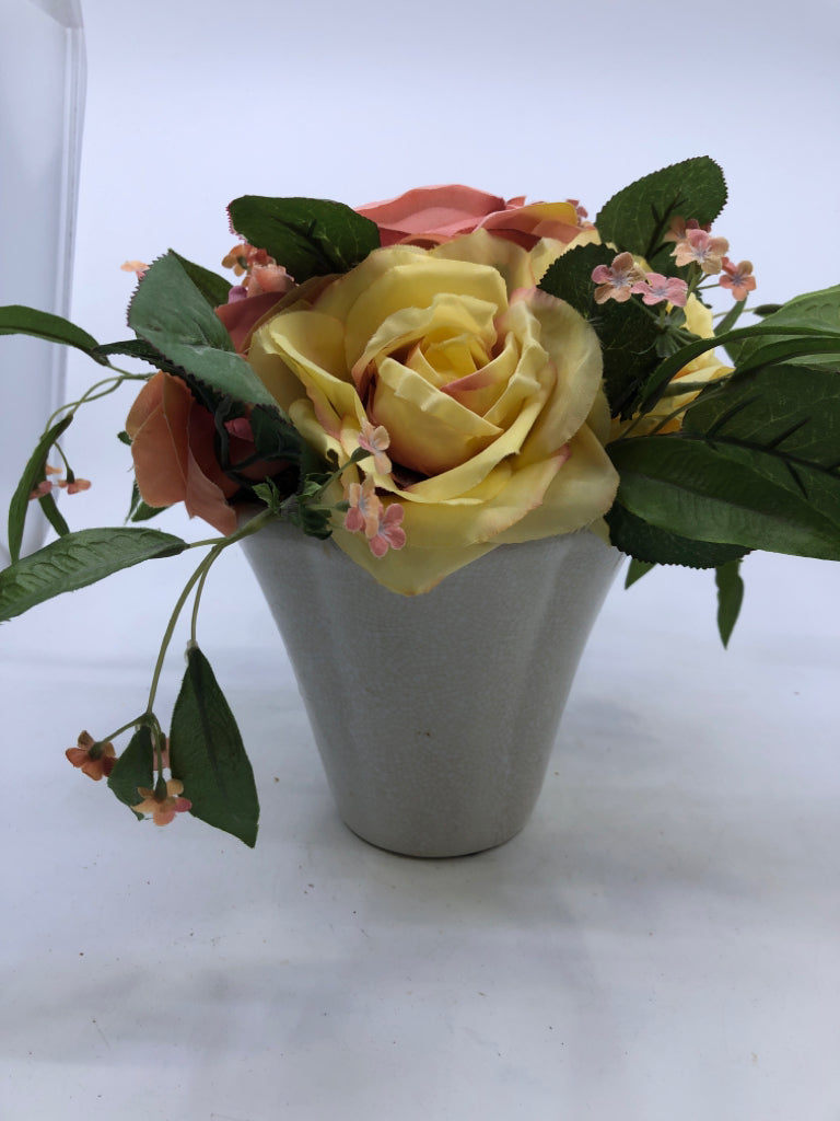 FAUX PINK YELLOW ROSES IN PLANTER.