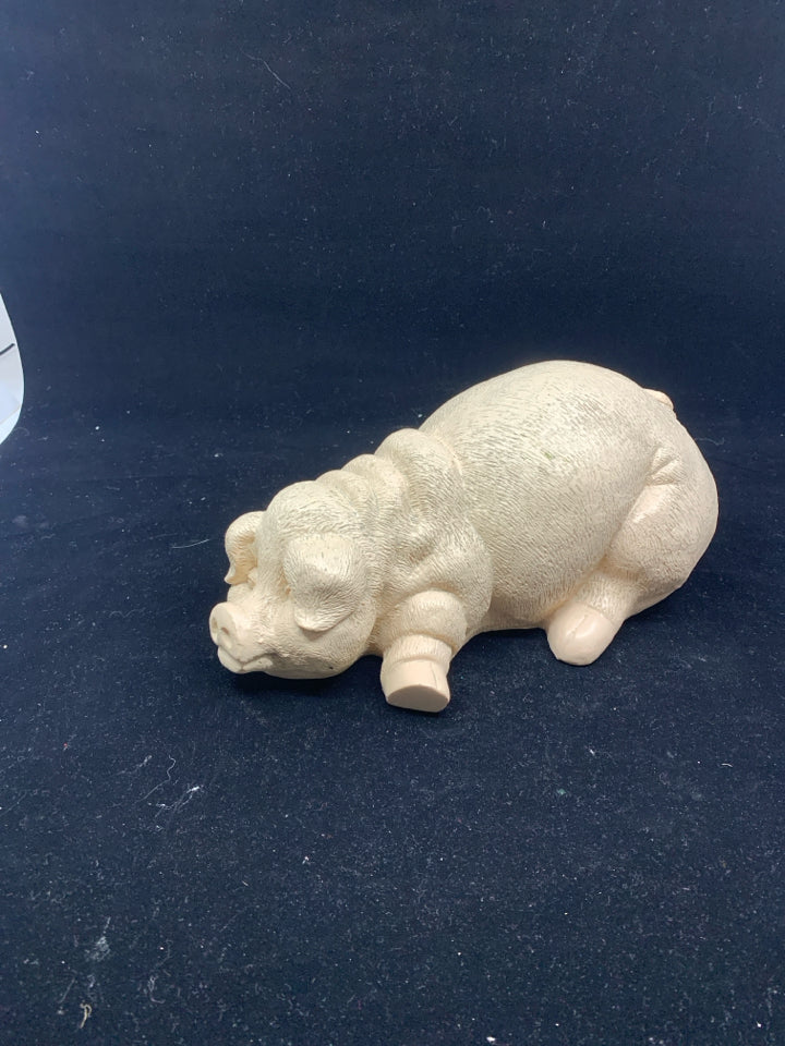 RESIN LAYING PIG.