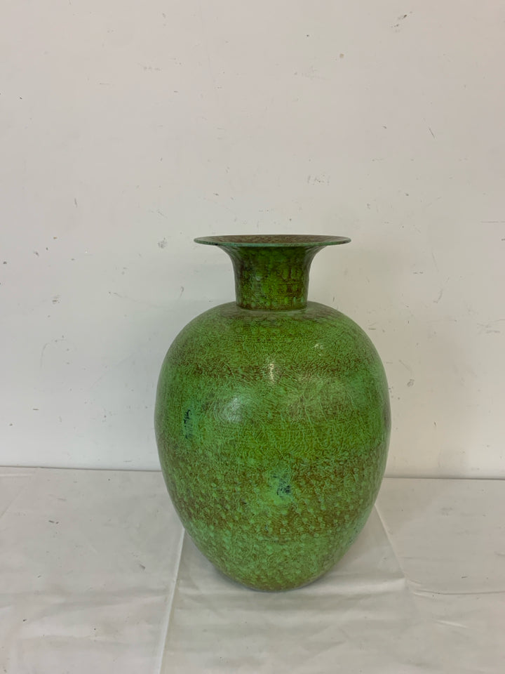 GREEN AND BROWN ROUND METAL VASE.