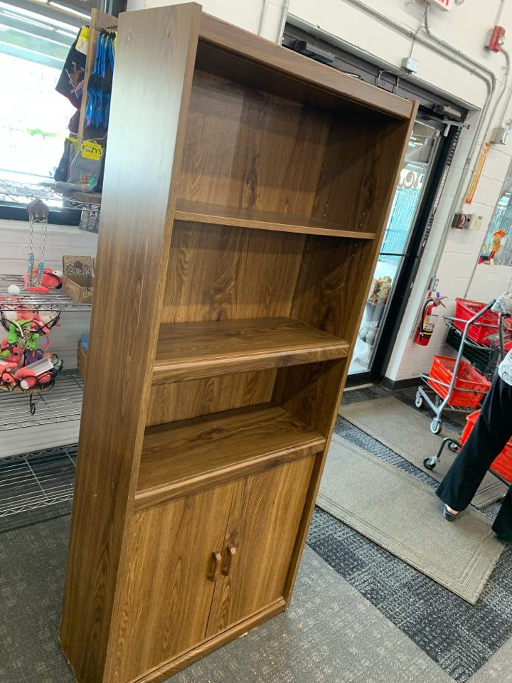 DARK FAUX WOOD BOOKCASE W/ BOTTOM CABINET.