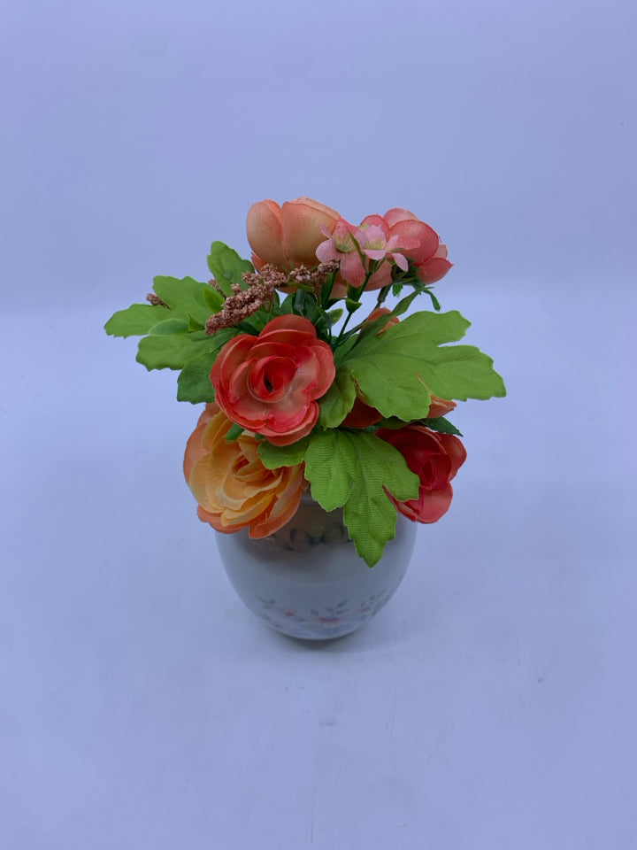 FAUX ORANGE FLORAL IN ROUND PINK FLORAL PRINCESS HOUSE VASE.