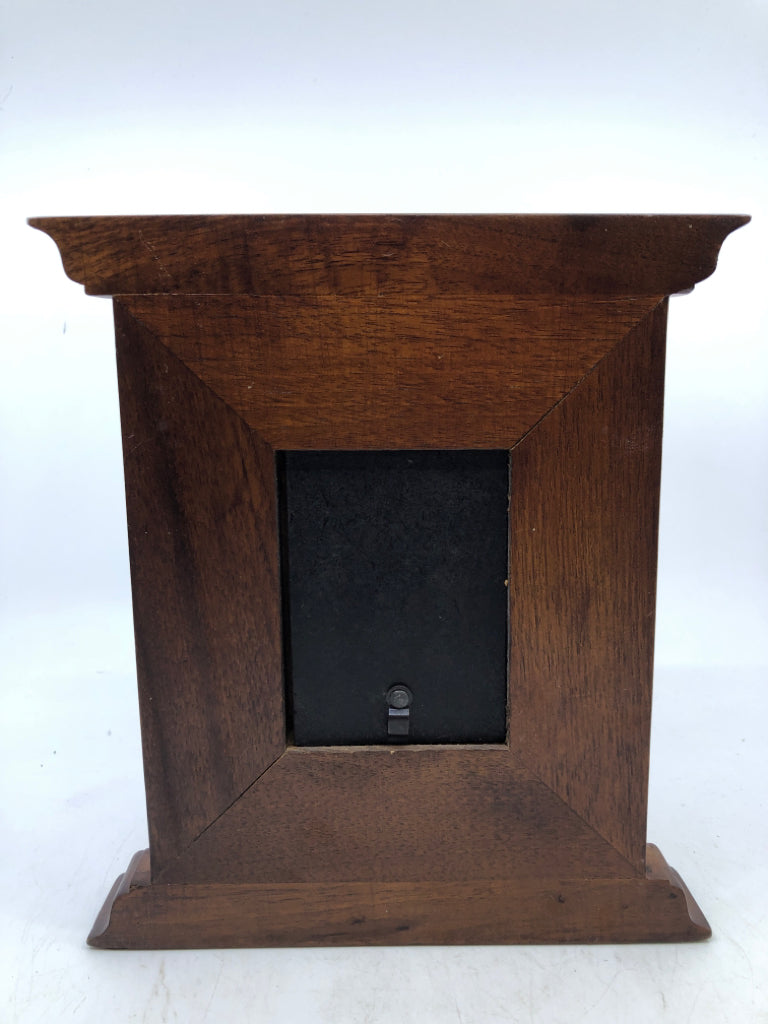 DARK WOOD STANDING FRAME W/ 3 PINK FLOWERS.